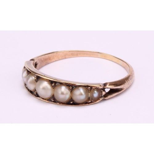 1239 - A Victorian tested 9ct gold seed pearl mourning ring, consists of seven graduated half seed pearls, ... 