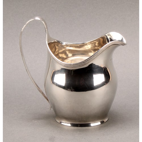 777 - A George III silver helmet shaped cream jug, 11cm high, London 1805, 130g