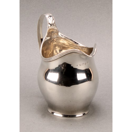 777 - A George III silver helmet shaped cream jug, 11cm high, London 1805, 130g