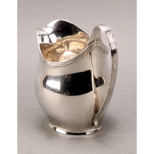 777 - A George III silver helmet shaped cream jug, 11cm high, London 1805, 130g