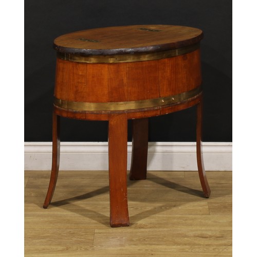 2471 - An early 20th century coopered hardwood drinks chest, hinged top folding flat as a bar, outswept leg... 