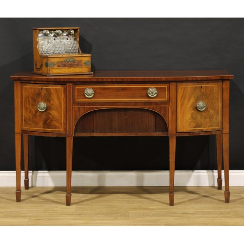 2093 - A 19th century mahogany sideboard or serving table, slightly oversailing top above a frieze drawer a... 