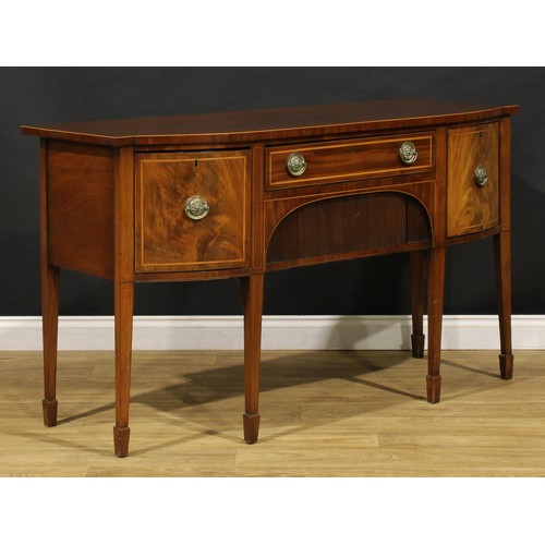 2093 - A 19th century mahogany sideboard or serving table, slightly oversailing top above a frieze drawer a... 