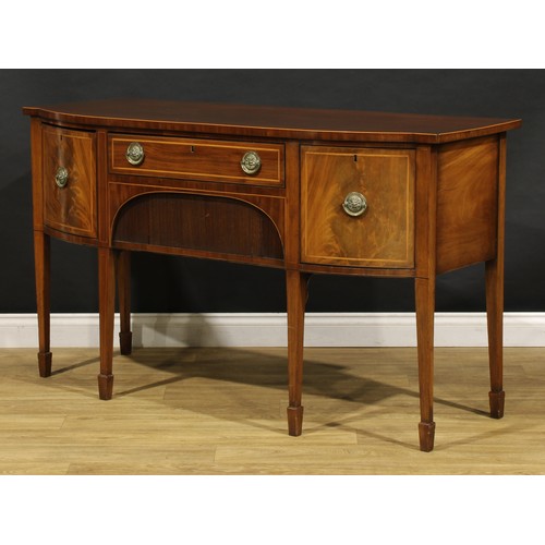 2093 - A 19th century mahogany sideboard or serving table, slightly oversailing top above a frieze drawer a... 