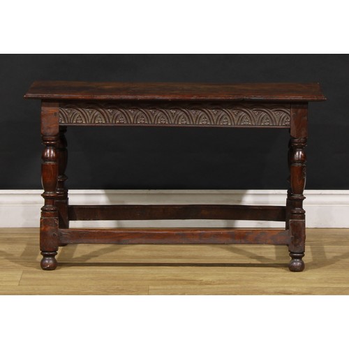 1882 - A 17th century style oak joint stool, rectangular top with moulded edge, the frieze carved with leaf... 