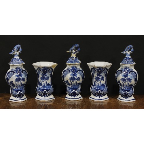 15 - An 18th century Delft five-piece garniture, decorated in underglaze blue with figures beneath a tree... 