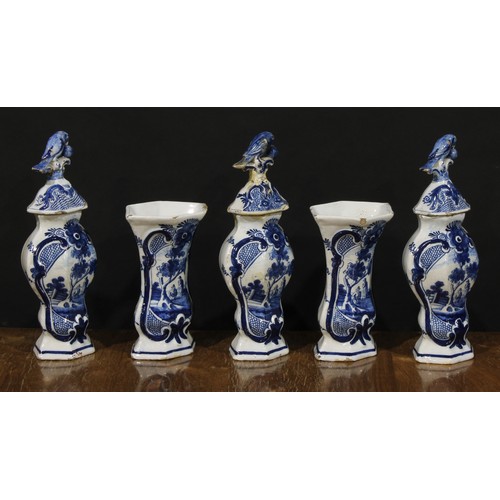 15 - An 18th century Delft five-piece garniture, decorated in underglaze blue with figures beneath a tree... 