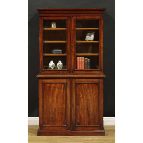 1948 - A Victorian mahogany library bookcase, of diminutive proportions, outswept cornice above a pair of g... 