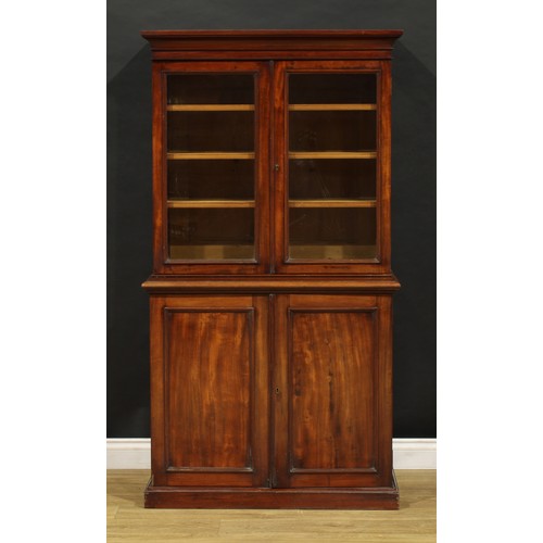 1948 - A Victorian mahogany library bookcase, of diminutive proportions, outswept cornice above a pair of g... 