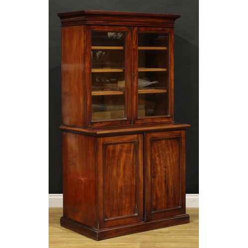 1948 - A Victorian mahogany library bookcase, of diminutive proportions, outswept cornice above a pair of g... 