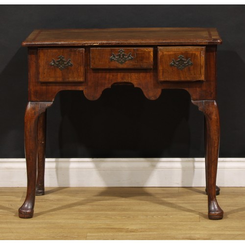 1497 - A George II walnut lowboy, moulded top above three frieze drawers, shaped apron, cabriole legs, pad ... 