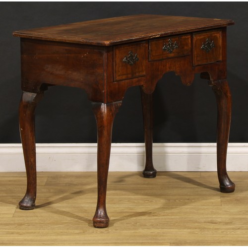 1497 - A George II walnut lowboy, moulded top above three frieze drawers, shaped apron, cabriole legs, pad ... 