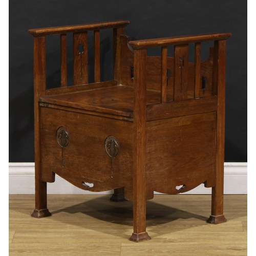 1510 - An Arts & Crafts copper mounted oak bedroom night seat, hinged top, pierced and applied with Art Nou... 