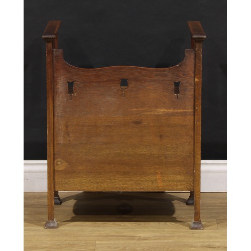 1510 - An Arts & Crafts copper mounted oak bedroom night seat, hinged top, pierced and applied with Art Nou... 