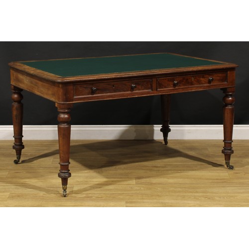 1949 - A Victorian mahogany library table, rounded rectangular top with inset writing surface above a pair ... 