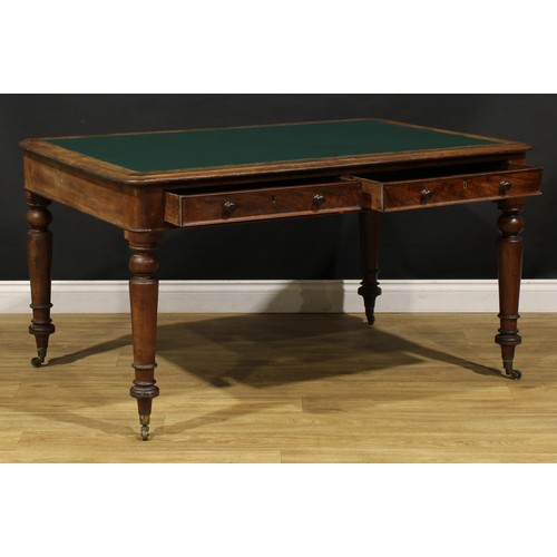 1949 - A Victorian mahogany library table, rounded rectangular top with inset writing surface above a pair ... 