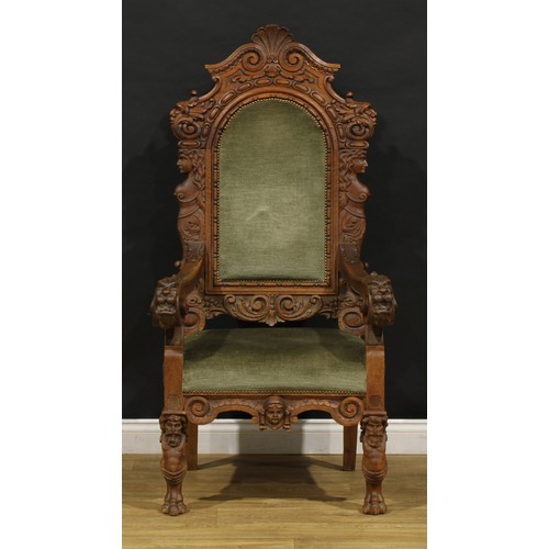 2354 - A Continental Baroque Revival armchair, stuffed-over upholstery, carved with Green Man masks, female... 