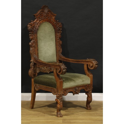 2354 - A Continental Baroque Revival armchair, stuffed-over upholstery, carved with Green Man masks, female... 