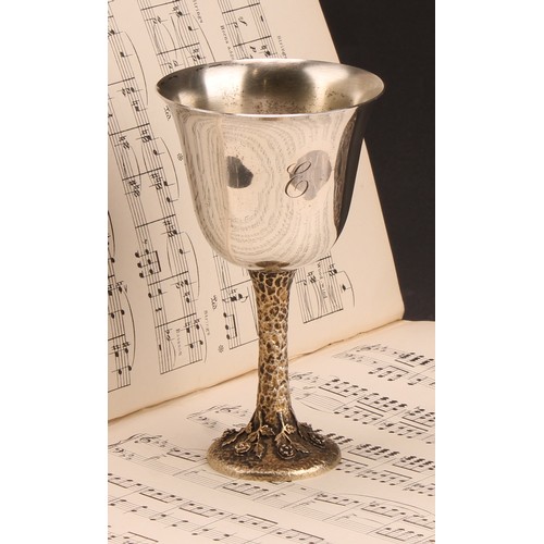 1052 - An Elizabeth II silver goblet, bell shaped bowl, silver gilt textured stem, the circular foot cast w... 