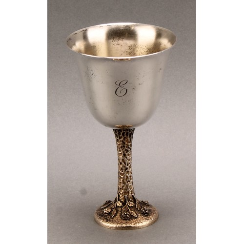 1052 - An Elizabeth II silver goblet, bell shaped bowl, silver gilt textured stem, the circular foot cast w... 