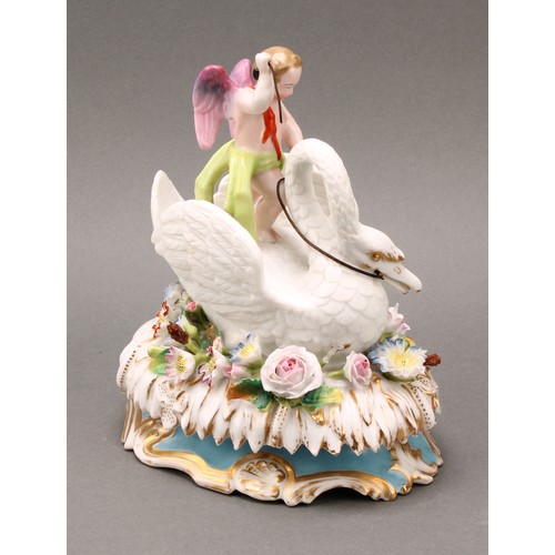 217 - A 19th century Jacob Petit, Paris, porcelain box and cover, Cupid riding a swan, on an oval bed of f... 