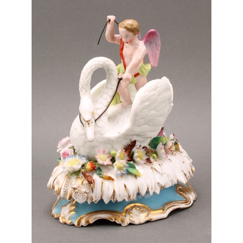 217 - A 19th century Jacob Petit, Paris, porcelain box and cover, Cupid riding a swan, on an oval bed of f... 