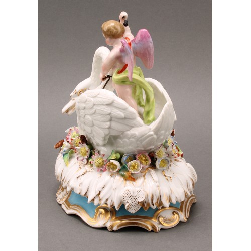 217 - A 19th century Jacob Petit, Paris, porcelain box and cover, Cupid riding a swan, on an oval bed of f... 