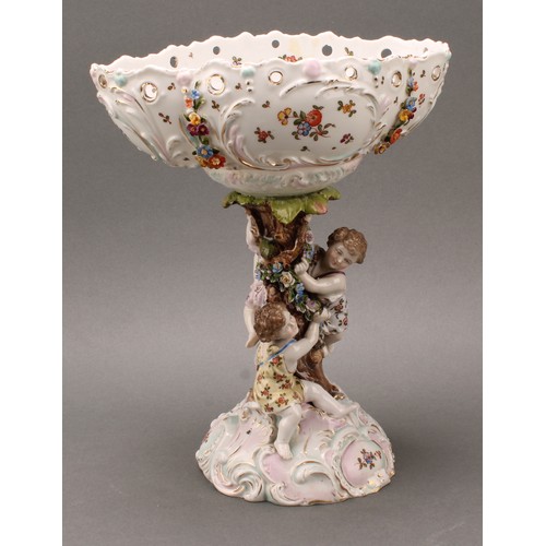 228 - A German porcelain figural table centrepiece or comport, Richard Eckert, Volkstedt, the pierced oval... 