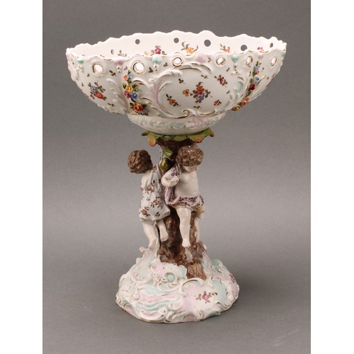 228 - A German porcelain figural table centrepiece or comport, Richard Eckert, Volkstedt, the pierced oval... 