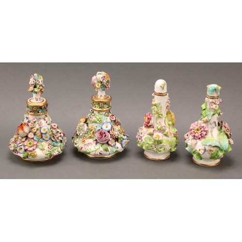 91 - A pair of Coalbrookdale porcelain pear shaped scent bottles, each encrusted in colourful summer flow... 