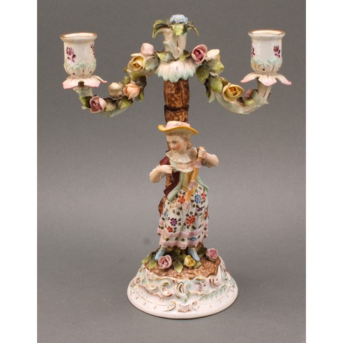 248 - A pair of Continental porcelain figural two branch candelabra, as a gallant and his companion, decor... 