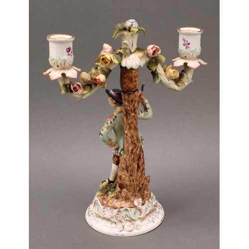 248 - A pair of Continental porcelain figural two branch candelabra, as a gallant and his companion, decor... 