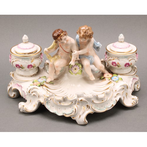 248 - A pair of Continental porcelain figural two branch candelabra, as a gallant and his companion, decor... 