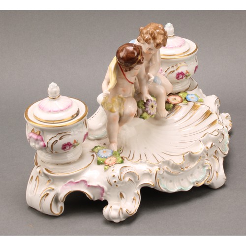 248 - A pair of Continental porcelain figural two branch candelabra, as a gallant and his companion, decor... 