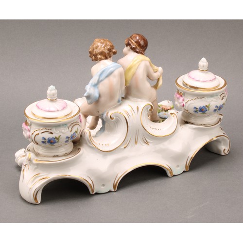 248 - A pair of Continental porcelain figural two branch candelabra, as a gallant and his companion, decor... 