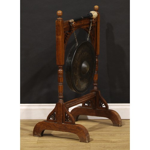 2465 - An Arts & Crafts period oak floor-standing gong, 89.5cm high, 59cm wide, 43cm deep, the parcel-gilt ... 