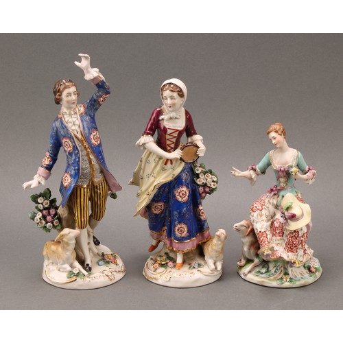 257 - A pair of Samson Paris porcelain figures, of a shepherd and sherherdess, both standing with lamb at ... 