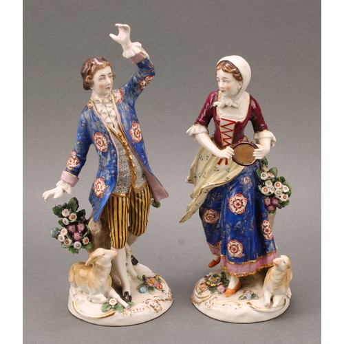 257 - A pair of Samson Paris porcelain figures, of a shepherd and sherherdess, both standing with lamb at ... 