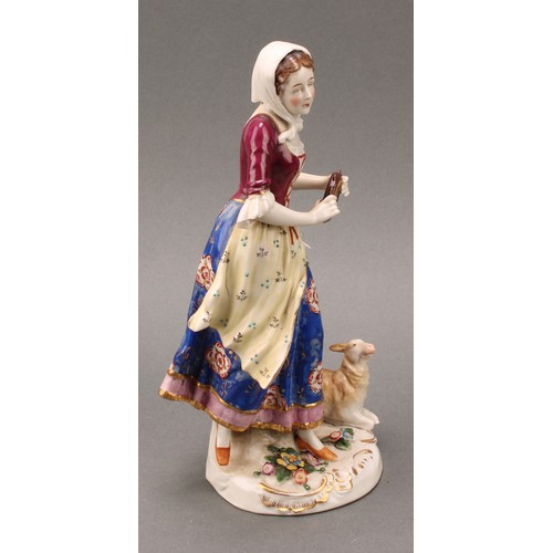 257 - A pair of Samson Paris porcelain figures, of a shepherd and sherherdess, both standing with lamb at ... 