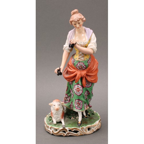 250 - A pair of French porcelain figures, of musicians, he playing the flute with a dog at his feet, she p... 