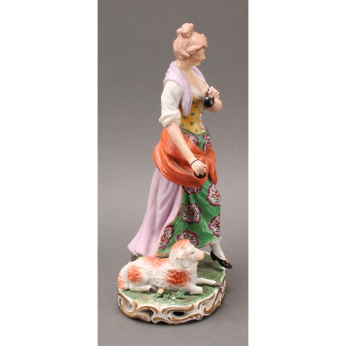 250 - A pair of French porcelain figures, of musicians, he playing the flute with a dog at his feet, she p... 