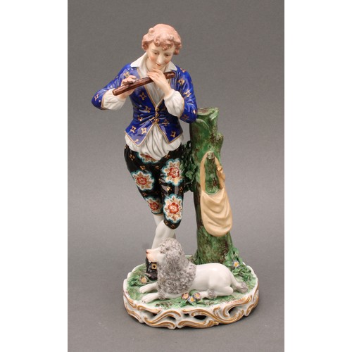 250 - A pair of French porcelain figures, of musicians, he playing the flute with a dog at his feet, she p... 