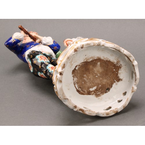 250 - A pair of French porcelain figures, of musicians, he playing the flute with a dog at his feet, she p... 