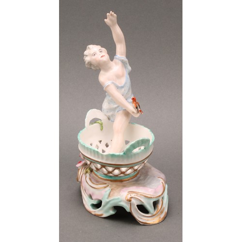 253 - A pair of German porcelain figural table salts, of a gallant and companion, each seated between two ... 