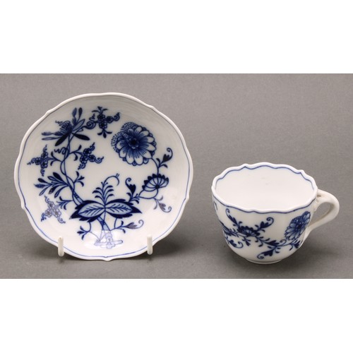 238 - A Meissen Onion pattern teacup and saucer, 10.5cm diameter, crossed swords mark in underglaze blue, ... 