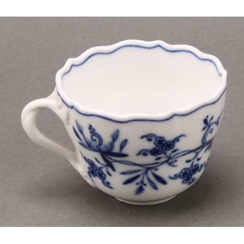 238 - A Meissen Onion pattern teacup and saucer, 10.5cm diameter, crossed swords mark in underglaze blue, ... 