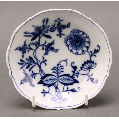 238 - A Meissen Onion pattern teacup and saucer, 10.5cm diameter, crossed swords mark in underglaze blue, ... 