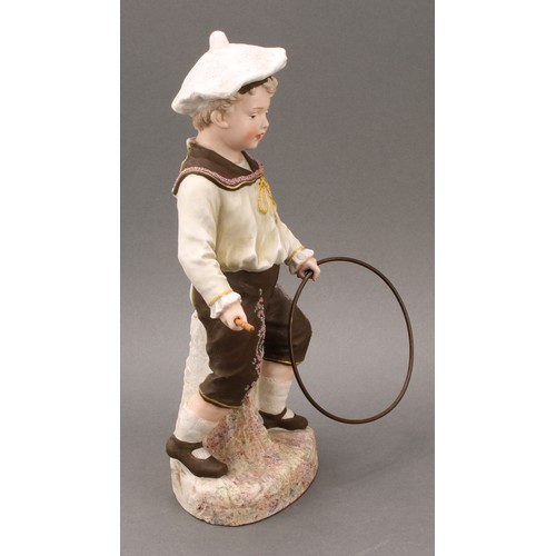 243 - A pair Gebrüder Heubach bisque figures, of a boy and girl at play, he with hoop and stick, she with ... 