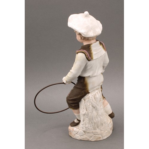 243 - A pair Gebrüder Heubach bisque figures, of a boy and girl at play, he with hoop and stick, she with ... 