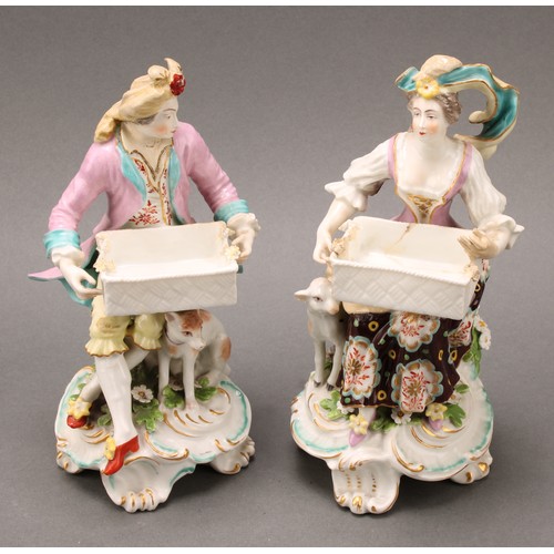 256 - A pair of Samson Paris porcelain figures, of a shepherd and shepherdess, each holding a rectangular ... 